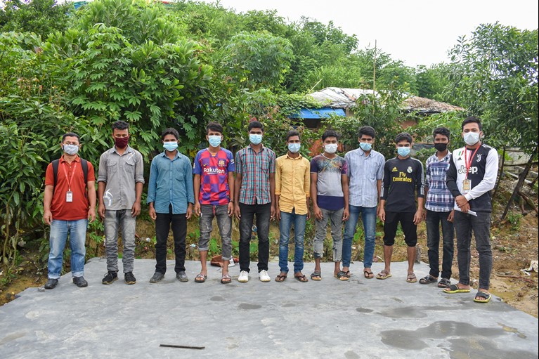 Caritas Bangladesh staff and Rohingya WASH volunteers  in their Rohingya refugee camp in Cox’s Bazaar region of Bangladesh in August 2020. Photo credit: Inmanuel Chayan Biswas/Caritas Bangladesh.